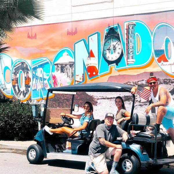 a man riding a motorcycle in front of a truck