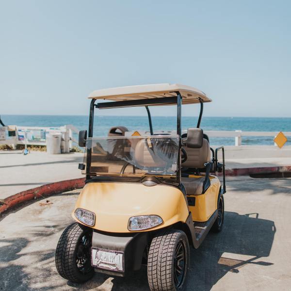 a small truck parked on the beach