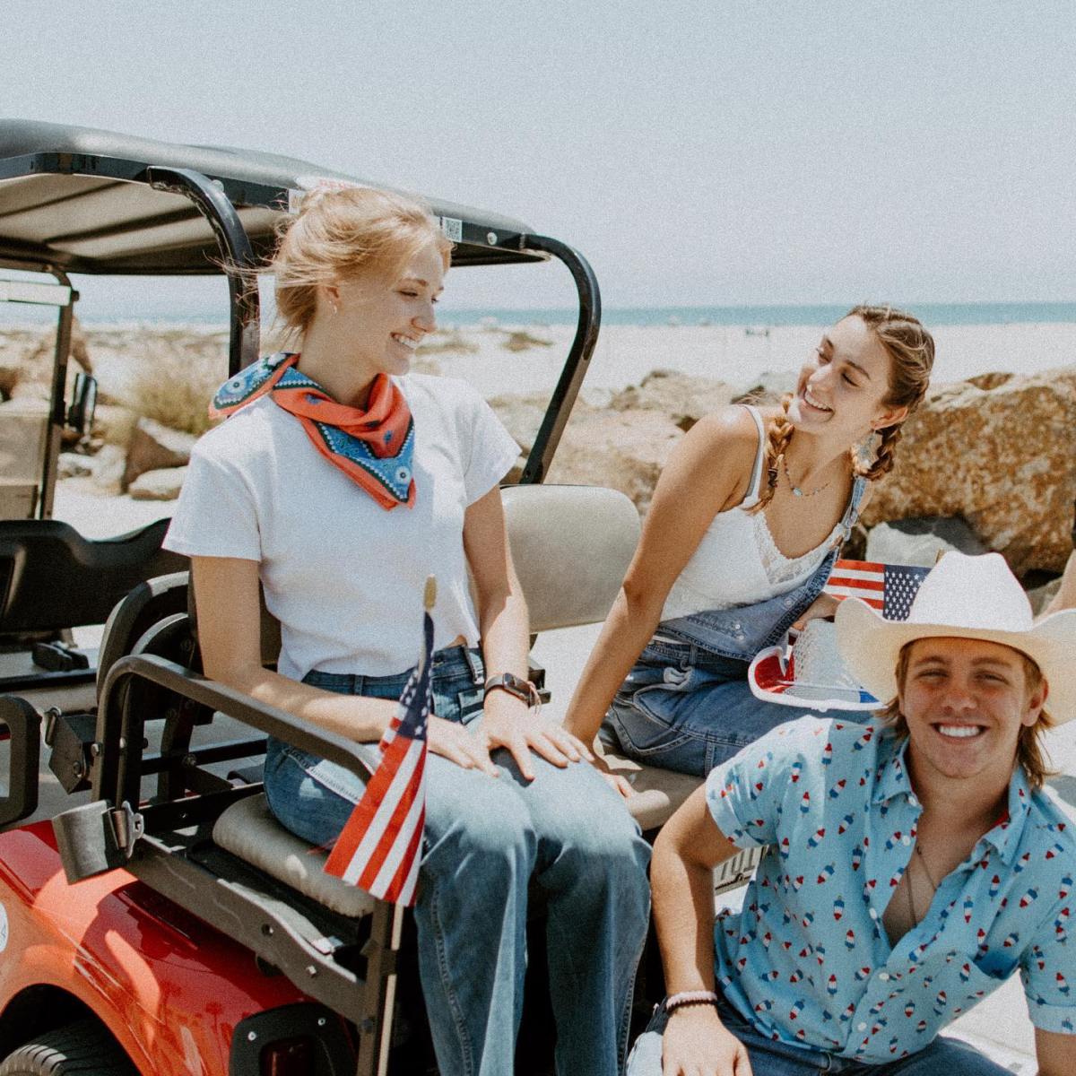 a group of people sitting on a motorcycle