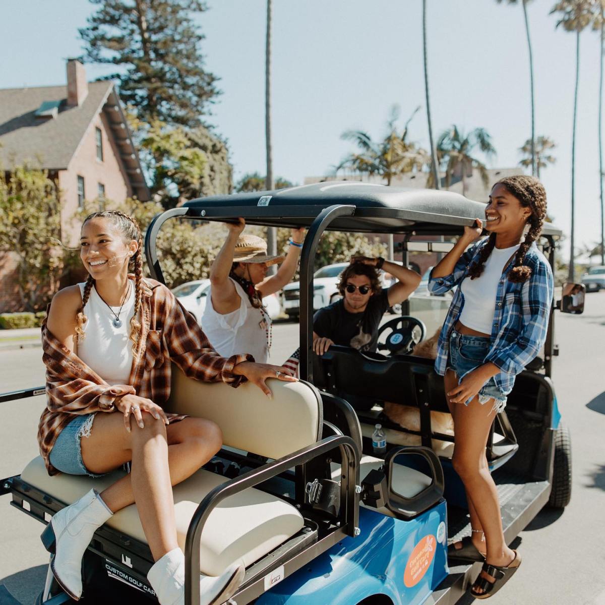 a group of people riding on the back of a truck