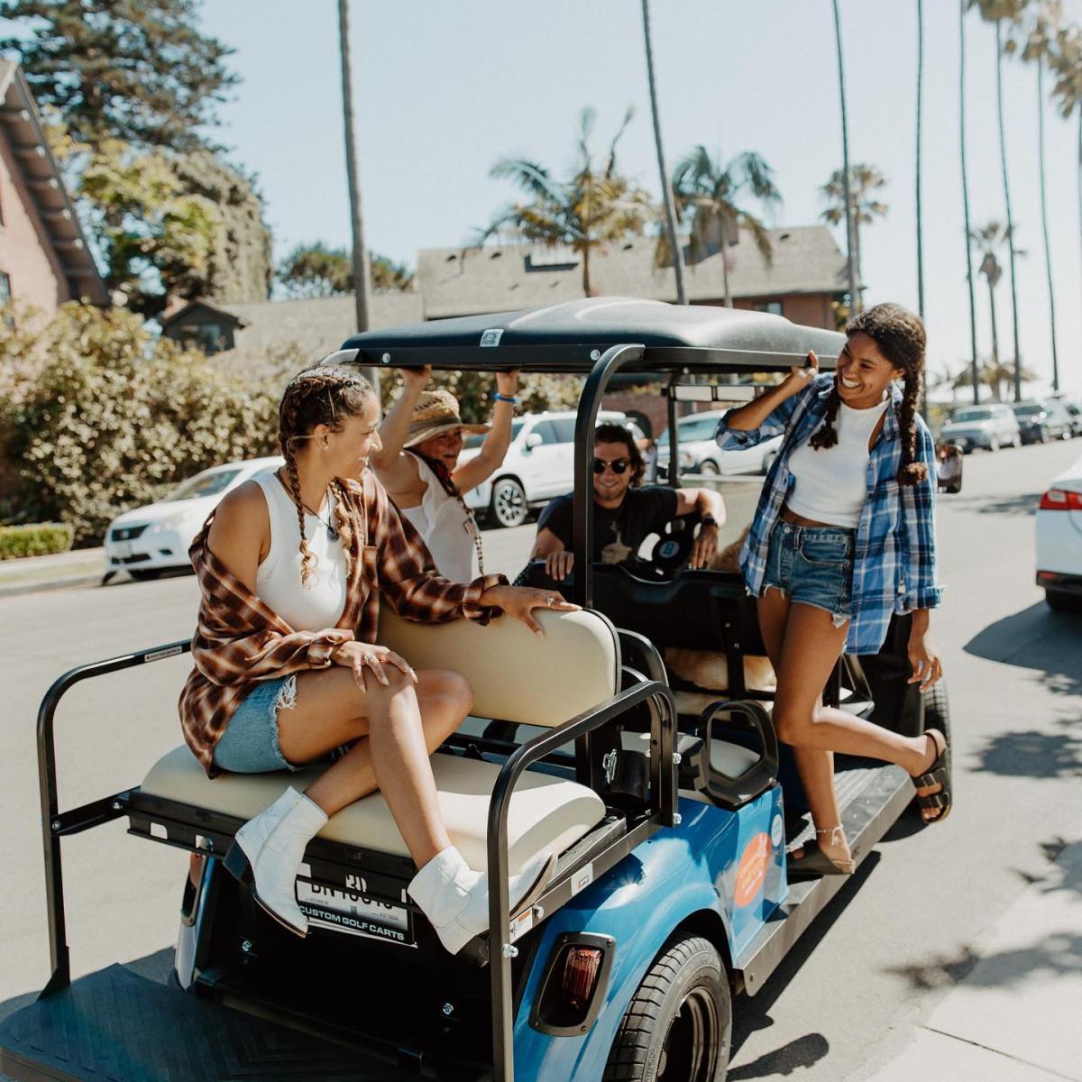 a group of people sitting on a motorcycle
