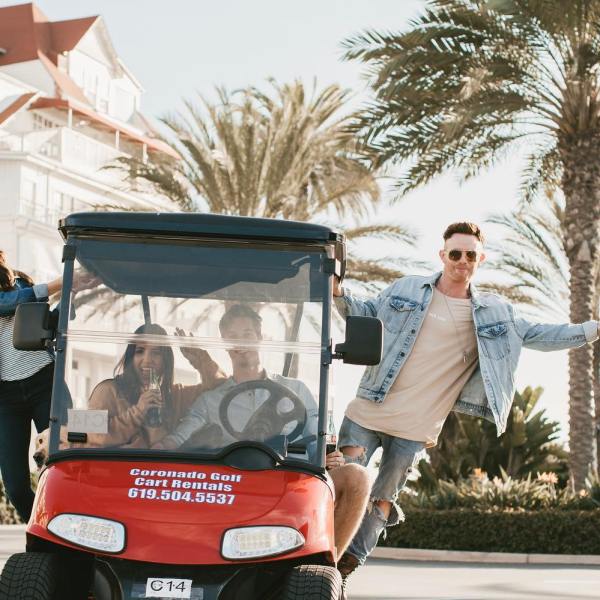 a person riding a motorcycle in front of a building