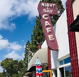 a sign in front of a building