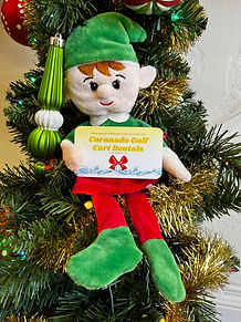 a group of stuffed animals sitting next to a christmas tree