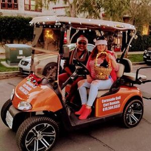 a group of people riding on the back of a truck
