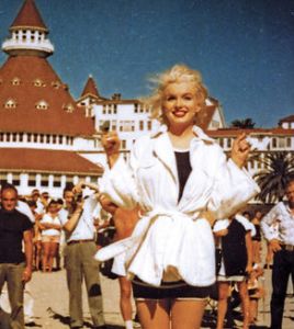 a group of people standing in front of a crowd posing for the camera