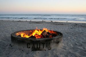 a boat sitting on top of a beach