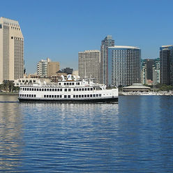 a large body of water with a city in the background