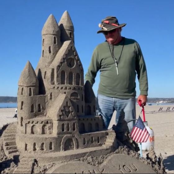 a man standing in front of a statue