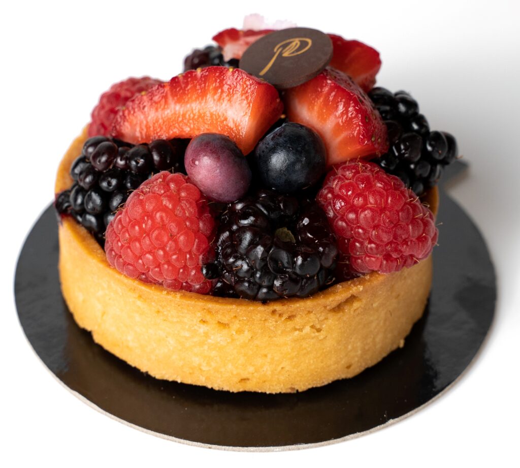 a cake with fruit on a plate
