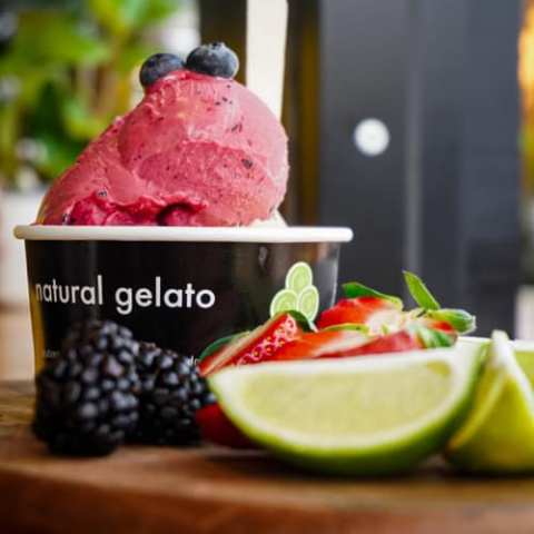 a cake with fruit on top of a table