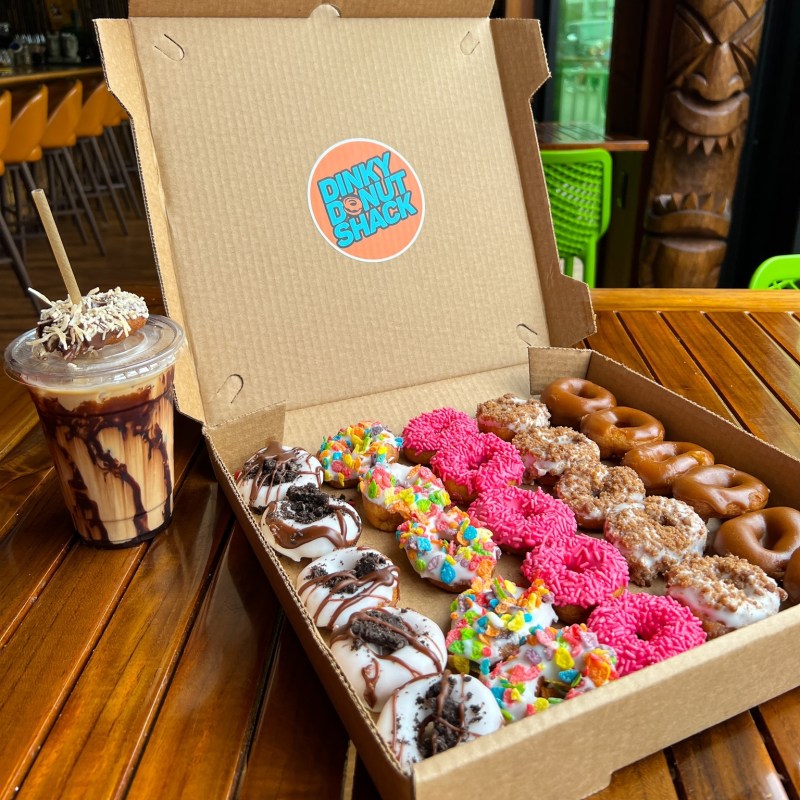 a train cake sitting on top of a wooden table