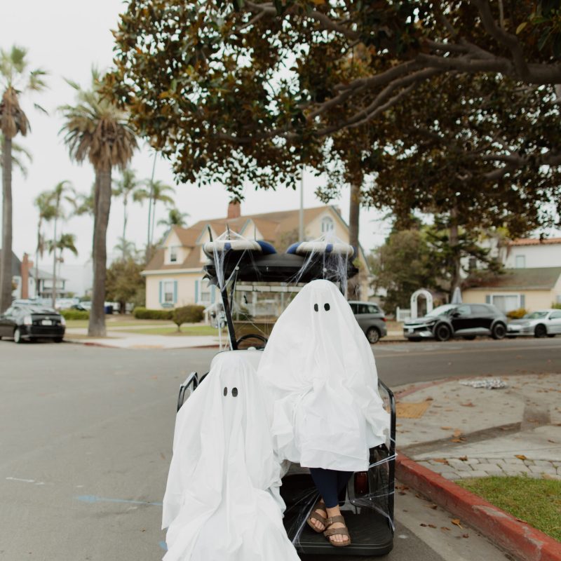 a person sitting on the side of a road