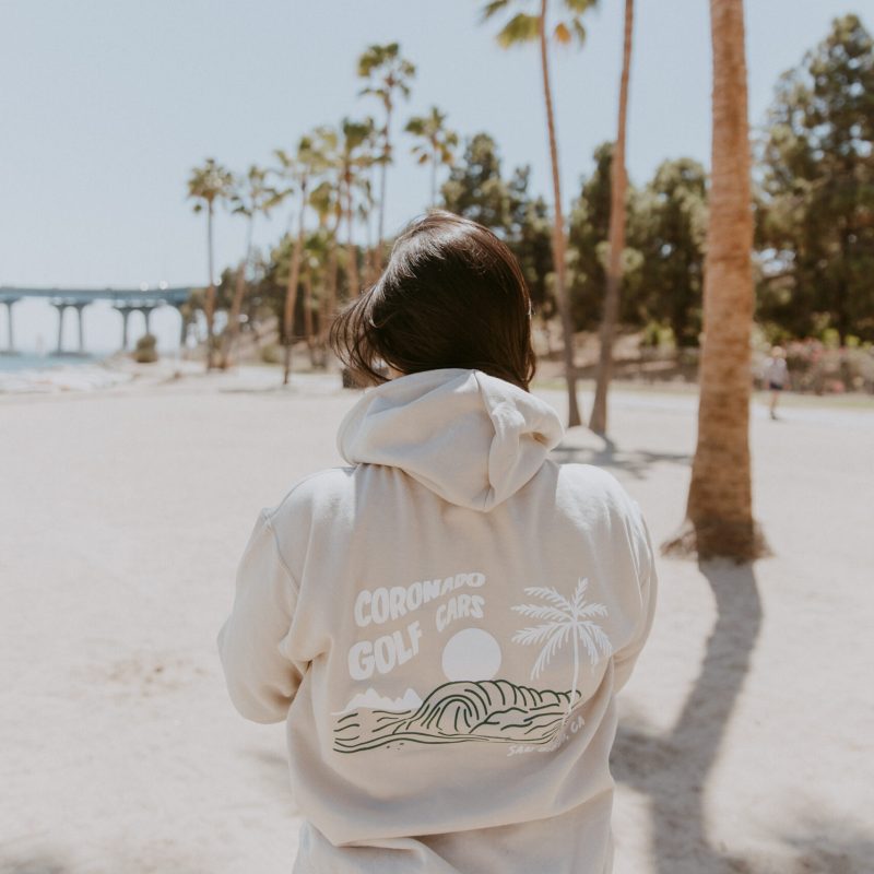 a person standing on top of a sandy beach