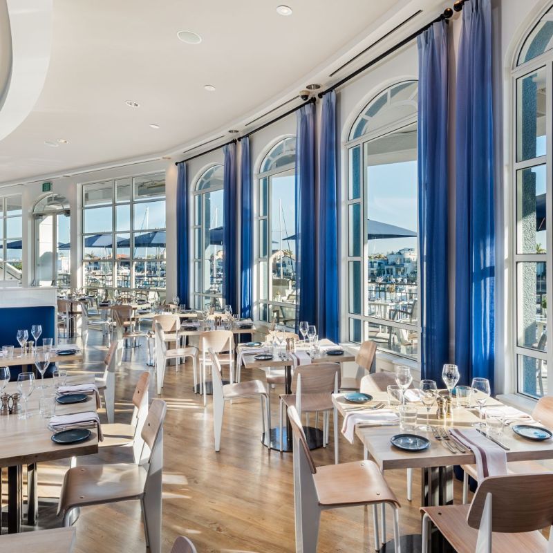 a dining room table in front of a window