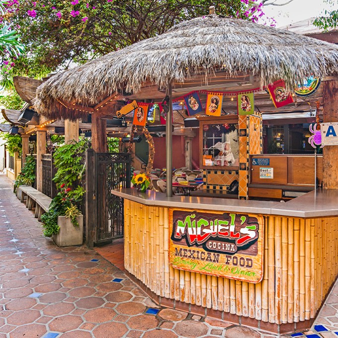 a group of people standing in front of a building