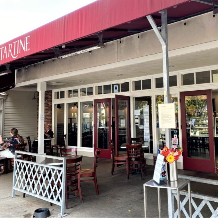 a chair sitting in front of a building