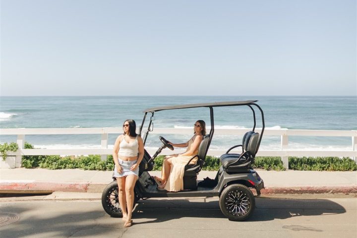 a person riding a motorcycle on a beach